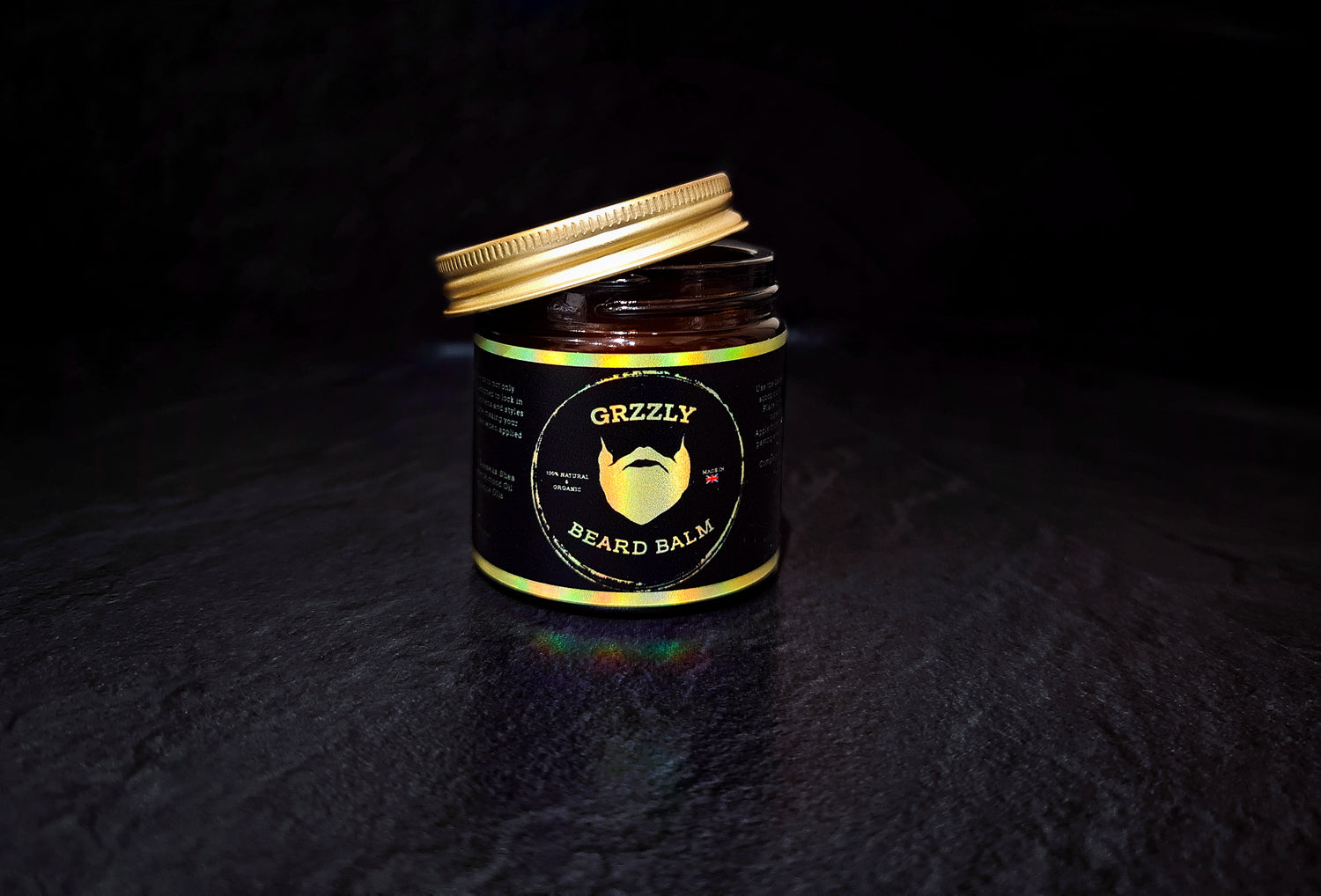 natural beard balm in a pot on a dark background