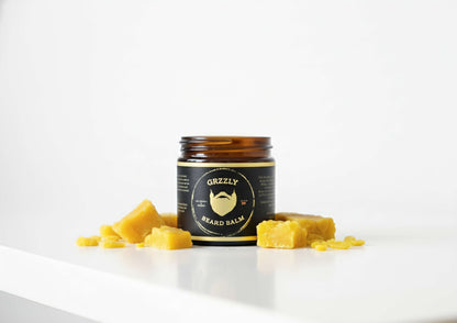 A Amber 2 oz glass jar of the best all natural handmade styling beard balm from grzzly beard co